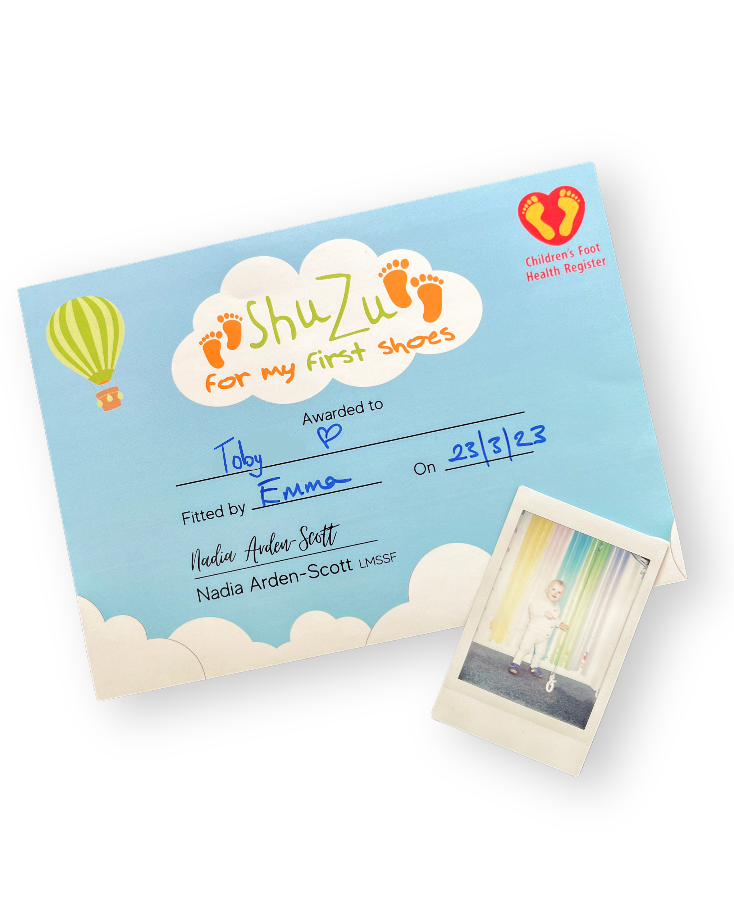 ShuZu first shoes certificate awarded to Toby on 23/3/23, fitted by Emma, with a Polaroid photo of a toddler in their new ...
