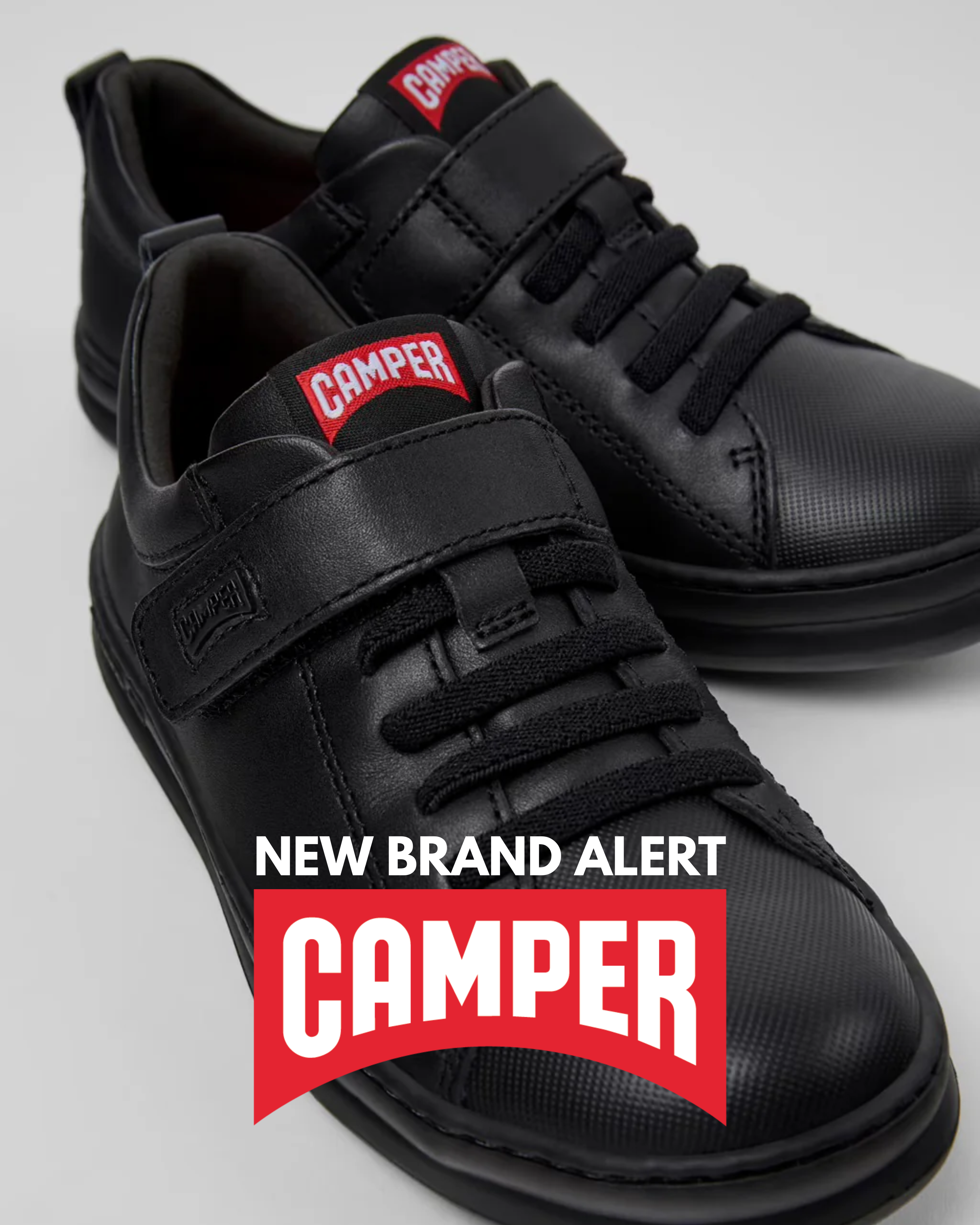 New brand alert: Camper children's black leather trainers with velcro strap, laces and signature red Camper logo badge.
